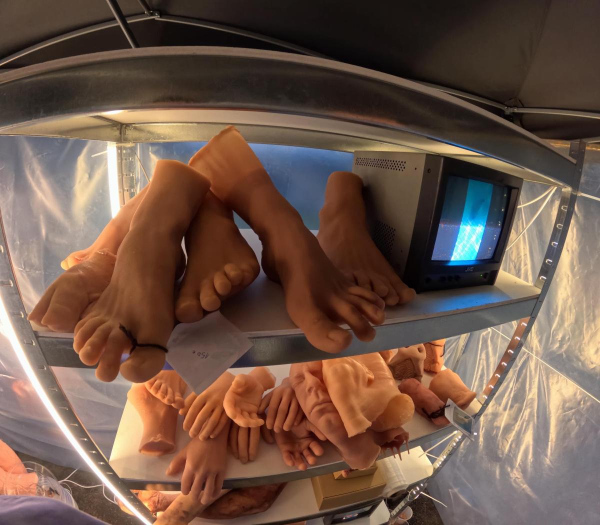 AwithA Body Shop installation detail with silicone body casts and CRT monitor, Lapinlahti Film Festival, Helsinki, 2026